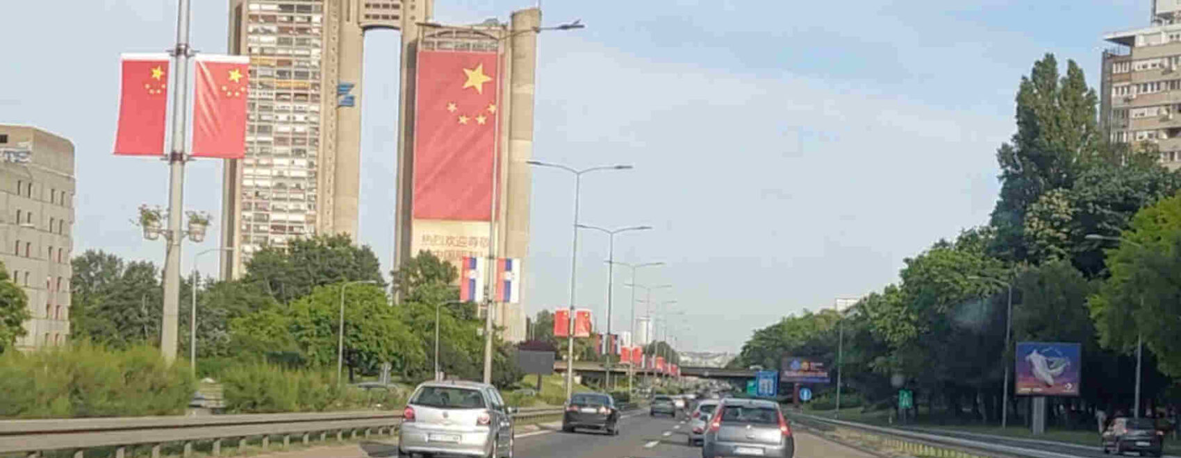 Chinese flags adorn the highway in Belgrade and the Genex Tower