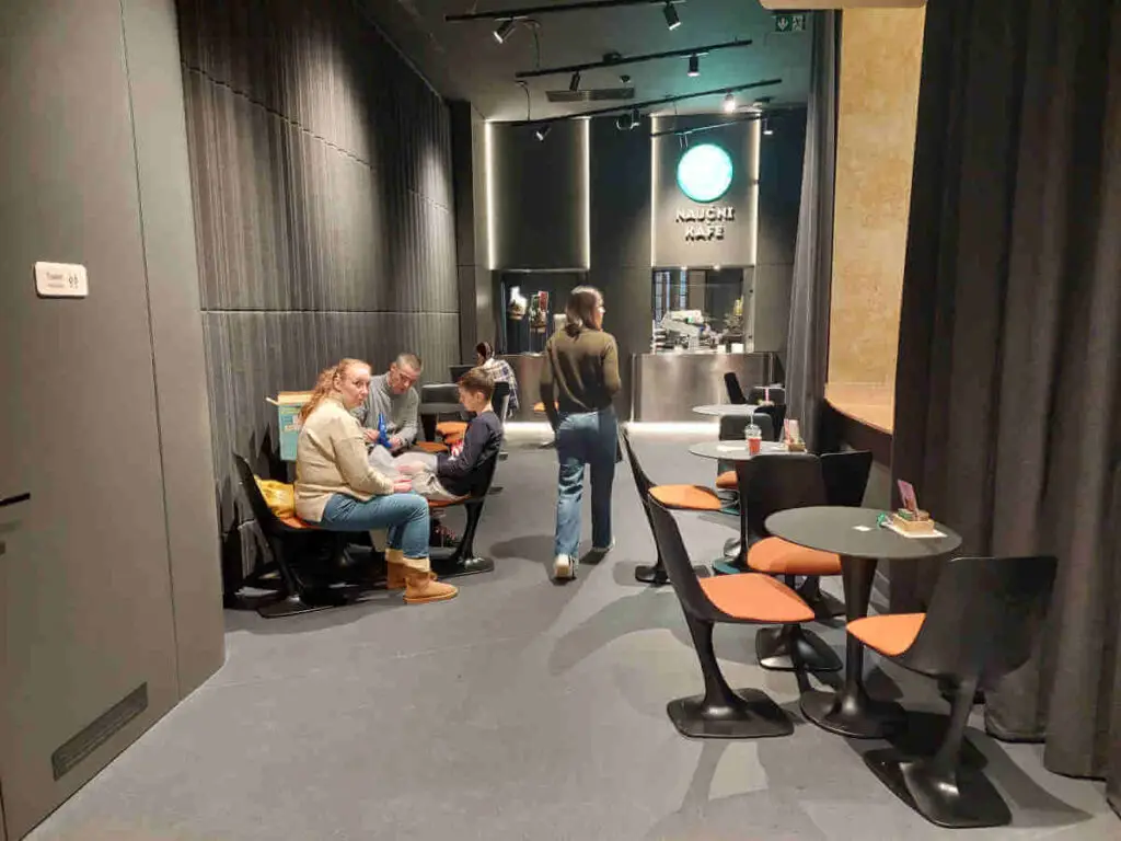 
The Science Café offers a unique experience where visitors can enjoy a cup of coffee served by a robotic arm.